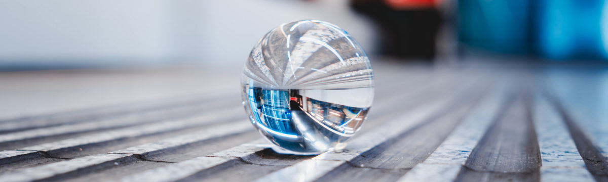 Crystal ball in a subway station. Photo by Rico Reutimann on Unsplash