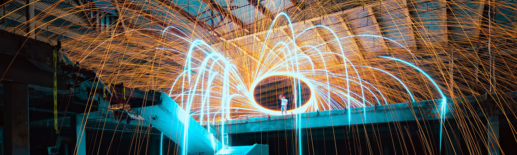 Factory with sparks Photo by Sean Pierce on Unsplash