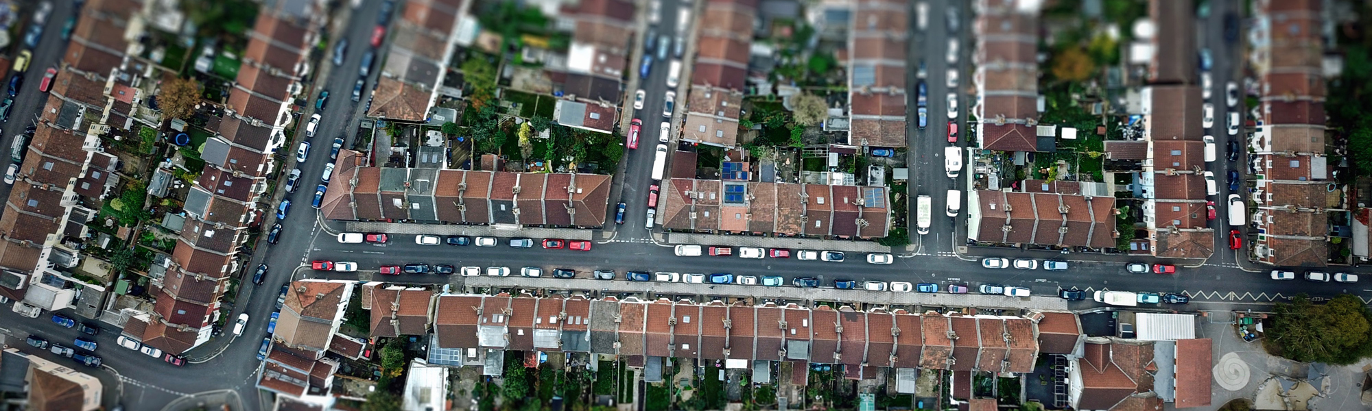 Solar panels on suburban roofs. Photo by Louis Reed on Unsplash