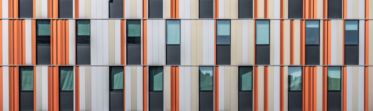 Orange window shuttters Photo by Bernard Hermant on Unsplash