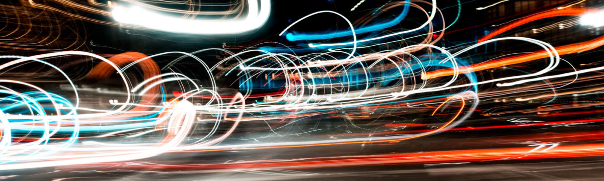 Traffic in motion at night Photo by Osman Rana on Unsplash