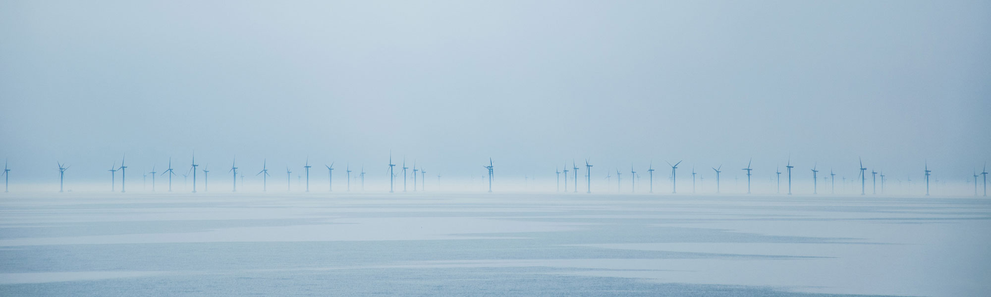 turbines at sea Photo by Irfan Alijagic on Unsplash